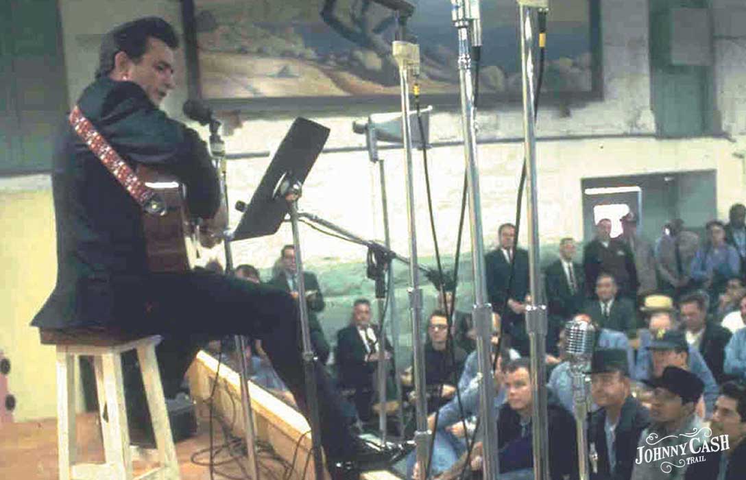 Image of Johnny Cash performing for inmates at Folsom Prison.